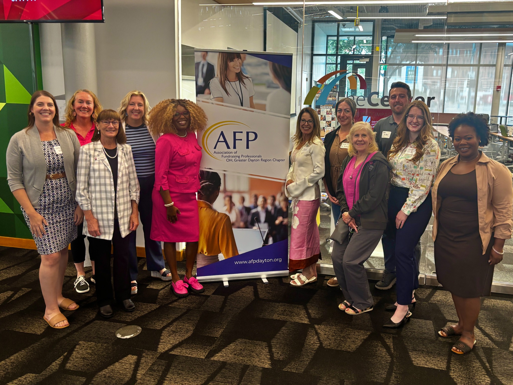 Whitney with a diverse group of professionals after an Association of Fundraising Professionals event