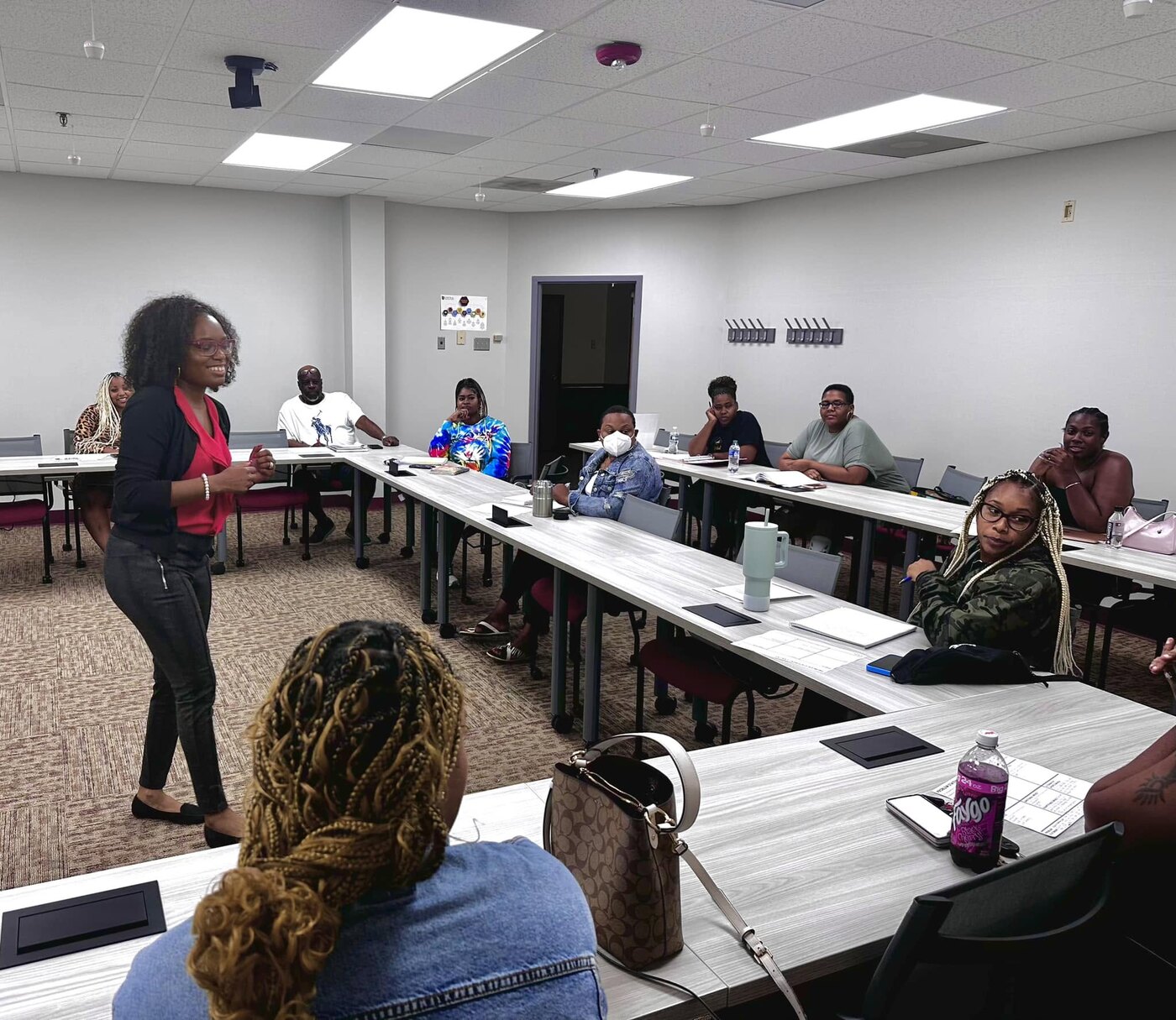 Whitney facilitating a classroom session with entrepreneurs