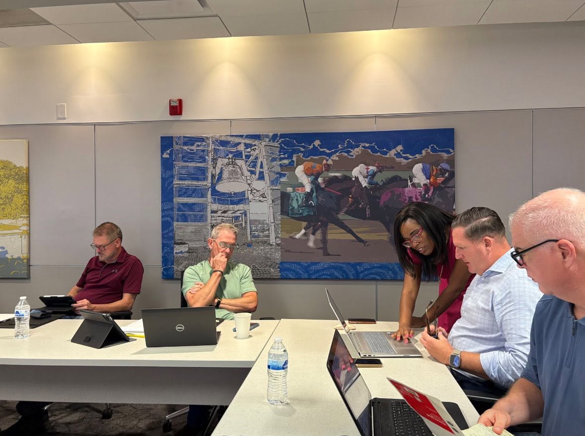 Whitney helping participants during a hands-on technology session